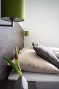 Postel nebo postele na pokoji v ubytování eee Hotel Graz
