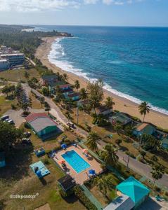 an aerial view of a beach with a swimming pool at Parador Villas Del Mar Hau in Isabela