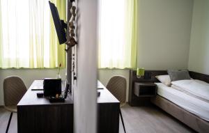 Postel nebo postele na pokoji v ubytování eee Hotel Graz