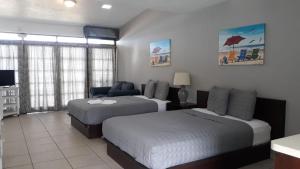 Postel nebo postele na pokoji v ubytování Parador Villas Del Mar Hau