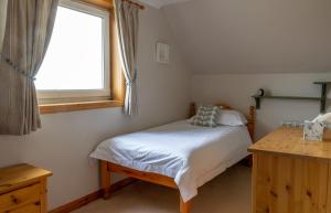 Postel nebo postele na pokoji v ubytování Ar Dachaigh, North Uist