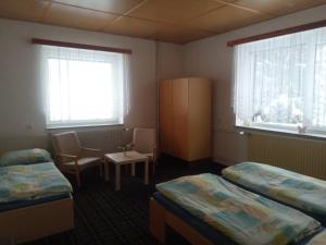 Postel nebo postele na pokoji v ubytování Penzion Chata Na Mlýně