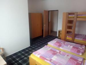 Postel nebo postele na pokoji v ubytování Penzion Chata Na Mlýně