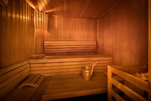 a wooden sauna with a trash can in it at Valamar Diamant Hotel in Poreč
