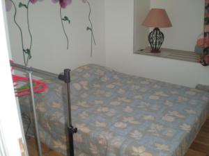 En eller flere senge i et værelse på Maison du Chapitel