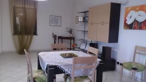 a kitchen with a table and chairs in a room at B&B La Rocca in Bassano Romano