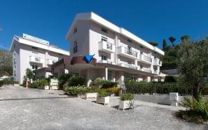 a large white building with a large window at Virgilio Grand Hotel in Sperlonga