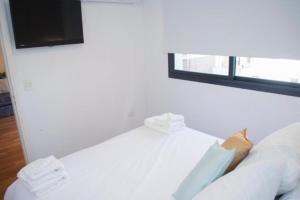 Postel nebo postele na pokoji v ubytování Guemes Apart Nueva Cordoba