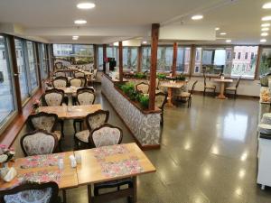 a restaurant with tables and chairs and windows at Gulec Hotel & Spa - Special Category in Istanbul