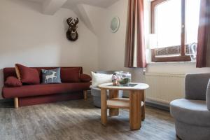 Posezení v ubytování Landhotel Baumwipfel
