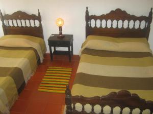 Voodi või voodid majutusasutuse Hospedaje y Zona de Camping Pistacho toas