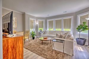 a living room with a couch and a tv at Family Apartment with Deck and Yard Near Northwestern in Evanston