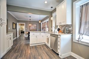 a kitchen with white cabinets and a counter top at Chicago Family Apartment - Kids and Pets Welcome! in Evanston