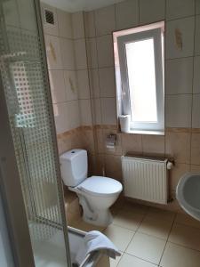 Kúpeľňa v ubytovaní Amberek Dom Gościnny