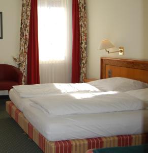Katil atau katil-katil dalam bilik di Hotel Ochsen Stuttgart