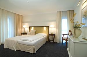 Katil atau katil-katil dalam bilik di Hotel Ochsen Stuttgart