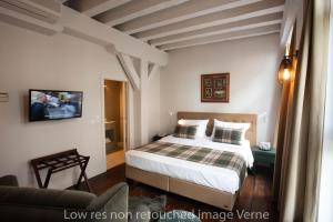 Letto o letti in una camera di Hotel 'T Sandt