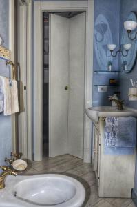 a bathroom with a sink and a toilet and a sink at L'oblò in Riomaggiore