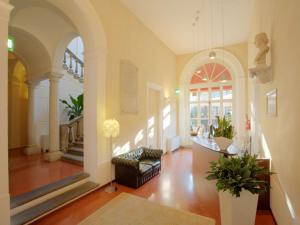 a living room with a couch and a table at Palazzo Galletti Abbiosi in Ravenna