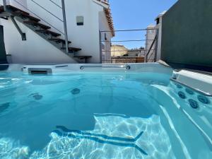 a swimming pool with a shark in the water at Casa Animas Casasol Centro in Nerja