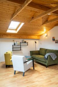 a living room with a couch and a table at Das Nordberg Apartments in Garmisch-Partenkirchen