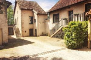 a house with a staircase in front of it at La Dolce Vita des Hautes Côtes in Magny-lès-Villers