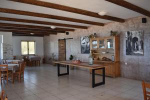 a kitchen and dining room with a table and chairs at Panorama Hotel in Falasarna