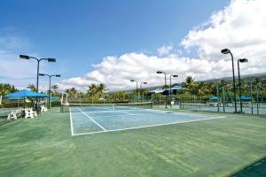 a tennis court with a net on top of it at Holua Resort in Kailua-Kona