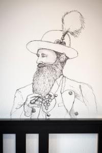 a drawing of a man wearing a hat at Das Nordberg Apartments in Garmisch-Partenkirchen