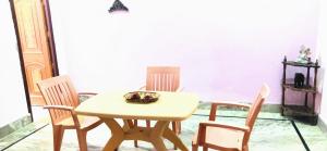 a dining room with a table and chairs at Agrawal Homestay in Haridwār