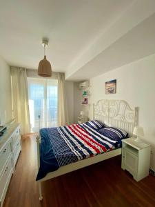 Postel nebo postele na pokoji v ubytování Scoica Alba Mamaia Nord Summerland + 7 fotografií