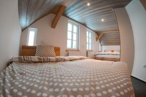 Postel nebo postele na pokoji v ubytování Chajda Harrachov
