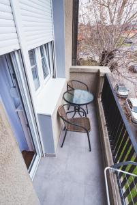 A balcony or terrace at Majestic Apartment