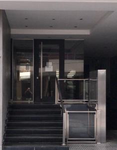 a staircase in a building with a person walking down it at Balcarce city in San Miguel de Tucumán