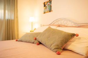 a bedroom with a bed with a pillow on it at PURA B&b in Noicattaro
