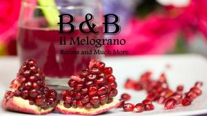 a glass of orange juice sitting on a table at B&B Il Melograno Antico con Terrazza e Giardino in Agrigento
