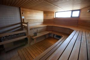 an inside view of a wooden sauna with a window at Scandic Patria in Lappeenranta