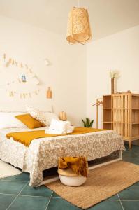a bedroom with a large bed and a rug at PURA B&b in Noicattaro