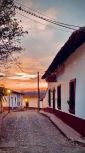 an empty street with a sunset in the background at Hotel De Cervantes in San Sebastián