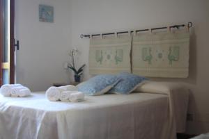 Postel nebo postele na pokoji v ubytování B&B Sa Serra