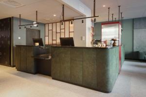 
a kitchen with a stainless steel counter top at Scandic Torget Bergen in Bergen

