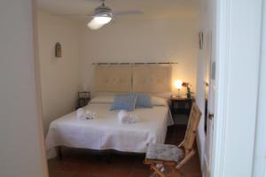 Postel nebo postele na pokoji v ubytování B&B Sa Serra