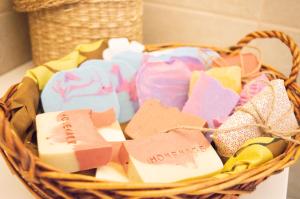 a basket filled with different types of soap at PURA B&b in Noicattaro