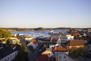 an aerial view of a small town with a harbor at Clarion Collection Hotel Grimstad in Grimstad