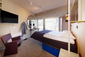 Кровать или кровати в номере Scandic Grensen