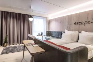 Säng eller sängar i ett rum på Hotel Norge by Scandic
