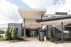 an entrance to a cancer center with a building at Scandic Helsinki Aviacongress in Vantaa