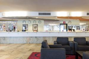 a waiting room with two chairs and a bar at Scandic Pohjanhovi in Rovaniemi