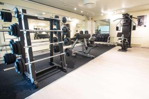 a gym with dumbbells and weights at Scandic Waskia in Vaasa
