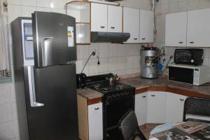 Een keuken of kitchenette bij Tres Marías Ciudad de San Juan